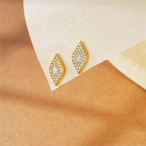 Detail of s925 silver gold geometric stud earring with marquise and pave zircons