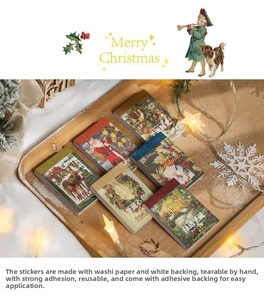 Close-up of vintage Christmas washi stickers on a wooden tray with festive pine decor