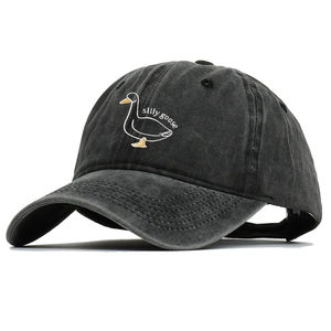 Close-up of silly goose embroidery on washed gray cotton vintage baseball cap