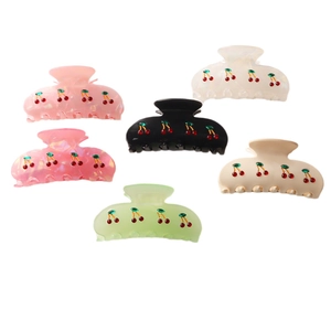 Set of sweet cherry hair claws in pink, white, black, and green colors for women