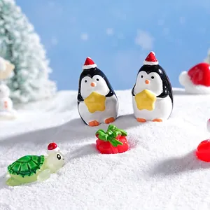 Miniature Christmas penguin and turtle figurines on snow for DIY micro landscape decor