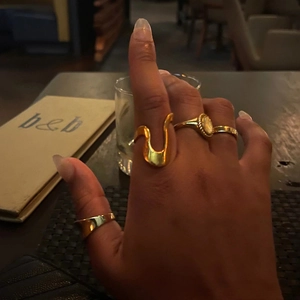 Set of four irregular gold plated stainless steel rings for women in minimalist style