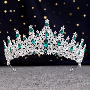 Detail of Baroque silver bridal crown with emerald crystals and multifaceted gemstones