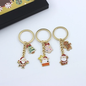 Christmas alloy keychains featuring Santa Claus, reindeer and snowflakes motifs