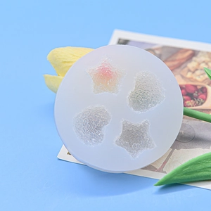 Mini silicone mold featuring heart and star shapes with crystalline textures for baking