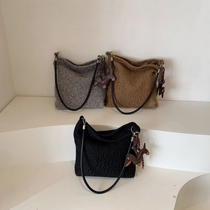 Fashionable wool-textured shoulder tote bags in gray, brown, and black with pony charms