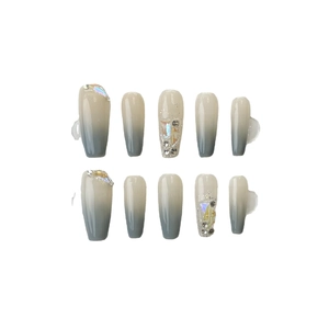 Handmade gradient blue and nude press-on nails with rhinestones in long coffin shape