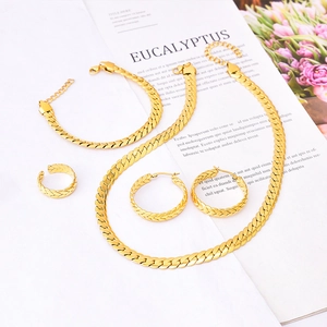 Golden woven titanium steel jewelry set featuring a necklace, bracelet, earrings and ring