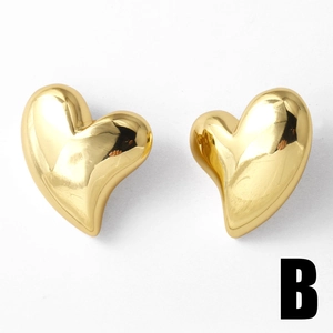 Polished 18k gold plated heart stud earrings with a glossy mirror finish on white background