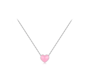 Close-up of a pink heart-shaped pendant with a delicate silver chain for women