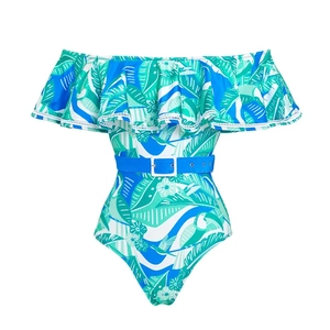 Detail of ruffled bandeau neckline and tropical palm leaf print on a one-piece swimsuit