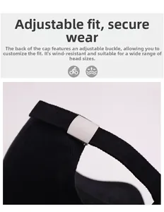 Detail view of the adjustable metal buckle and washed fabric on a black baseball cap