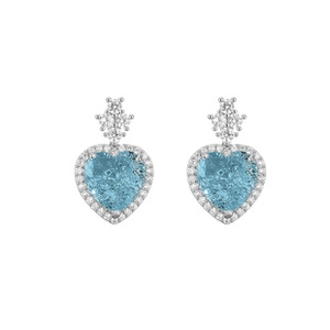 Detailed close-up of light blue heart-shaped earrings with sparkling diamond halo settings