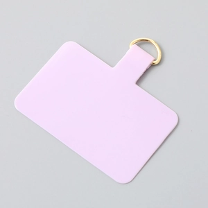 Universal lilac phone tether patch with a sturdy gold metal D-ring for secure wrist straps