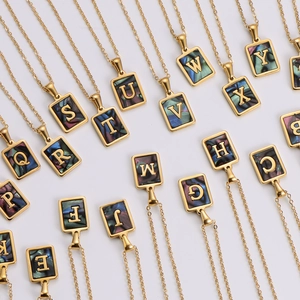 18k gold square pendant necklaces with colorful shell alphabet letters A-Z on white backdrop
