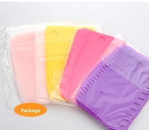 Detail view of 4-piece colorful plastic dough scrapers with hanging holes in packaging