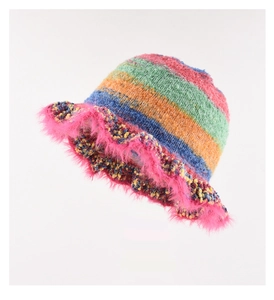 Detail of colorful rainbow knit bucket hat with pink fuzzy trim and vibrant stripes