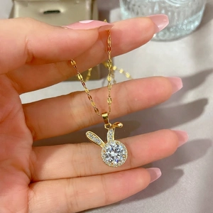 Golden rabbit pendant necklace with sparkling cubic zirconia and elegant polished chain