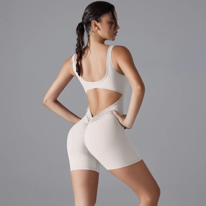 Detail of the open back cutout and ruched butt lifting design on this creamy yoga romper
