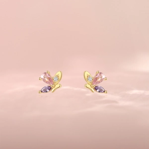 Detail of S925 silver butterfly earrings with pink pear and purple marquise cut crystals
