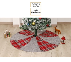 Detail of red plaid and grey knit patterns on a round Christmas tree skirt decoration