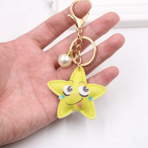 Cute yellow star PU leather keychain with cartoon face and gold ring charm