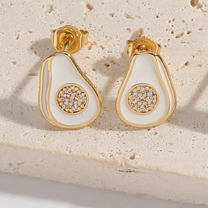 Macro detail of avocado-shaped gold earrings with white enamel and sparkling zircon