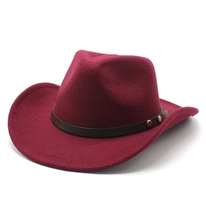 Detail of burgundy wool fedora with brown leather band and gold rivet accents