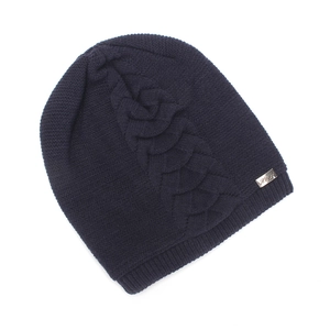 Detailed cable knit pattern on dark blue winter beanie with silver Heat metal label