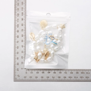 Detailed size measurement of bohemian starfish shell pearl necklace in packaging