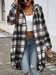 Street style shot of a casual plaid zip-up hoodie featuring a neutral color block design