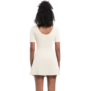 Detailed back view of white short-sleeve tennis dress with deep U-shaped open back design