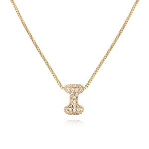 Detailed close-up of golden necklace pendant letter I with cubic zirconia pave