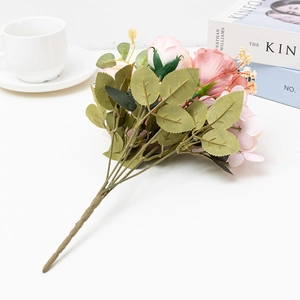 Elegant pink artificial hibiscus rose bouquet in a bright lifestyle setting for home decor