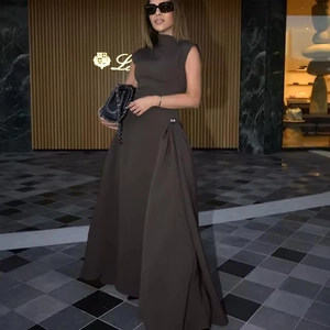 Detail of metal buckle on dark coffee sleeveless maxi dress with elegant waist pleats