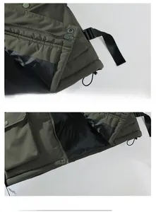 Detailansicht der armeegrünen Winterweste mit taktischer Schnalle und Metallreißverschluss