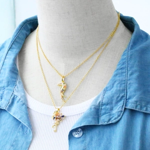 Layered gold necklaces with colorful zircon flamingo and toucan bird pendants