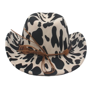 Western style cow print felt cowboy hat featuring a decorative brown leather cord
