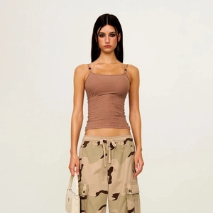 Slim fit brown ribbed tank top with camouflage multi-pocket cargo pants on a model