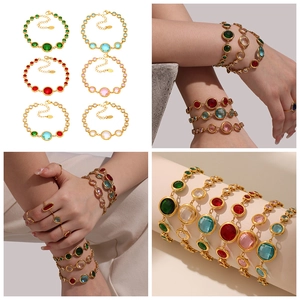 Detailed macro view of vintage gold-plated bracelet with multi-colored 5A cubic zirconia