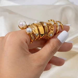 Elegant gold pearl ring set for women on satin fabric with a luxurious finish