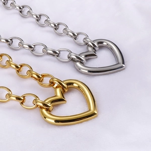 Fashionable gold and silver chunky chain necklaces with hollow heart pendants