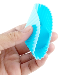 Close-up of flexible blue silicone muffin cup showing durable texture and elasticity
