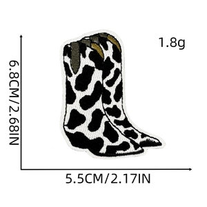 Detailed size view of black and white cow print cowboy boot embroidery patch