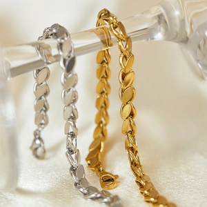 Minimalist stainless steel hollow heart bracelets in gold and silver woven chain styles