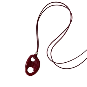 Minimalist resin oval pendant necklace with deep red organic shapes and silver bead detail