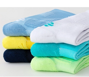 Detailed close-up of ribbed knit athletic socks in vibrant multi-color stack display