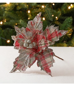 Macro view of red and green plaid velvet poinsettia with silver glitter on edges