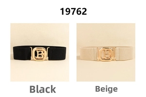 Detail view of elastic wide belts with gold B-letter buckles in black and beige colors