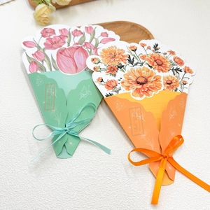 Detail view of 3D bouquet greeting cards with tulips and daisies on a wooden tray